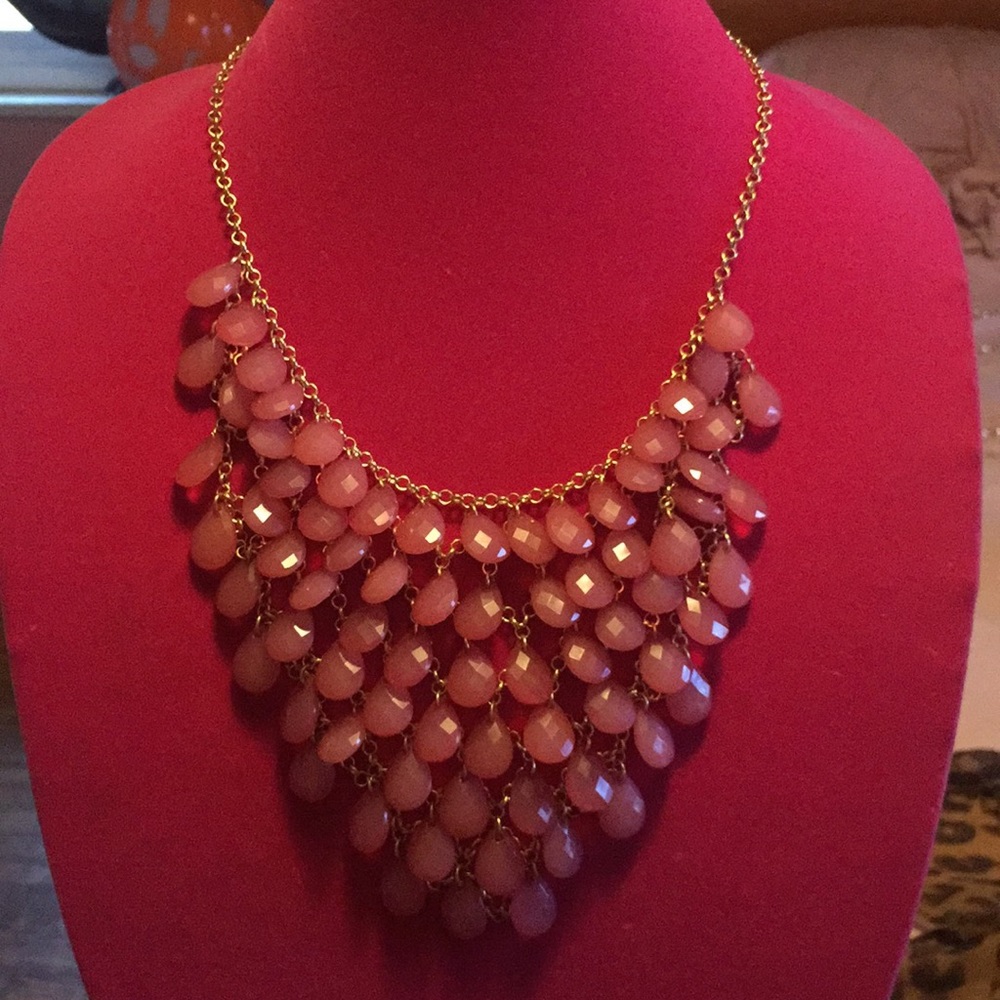 Pink necklace.
